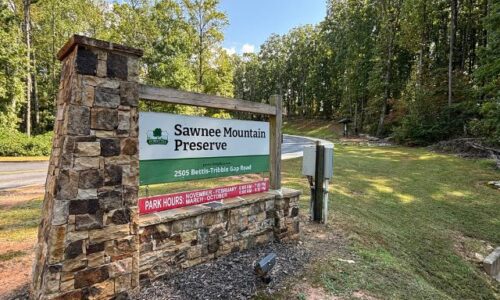 Front entrance sign of Sawnee Mountain Preserve in Cumming, Georgia