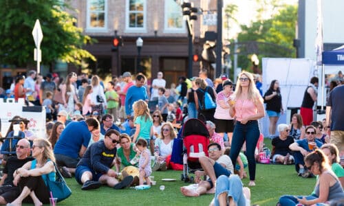 Visitors on lawn in Downtown Alpharetta